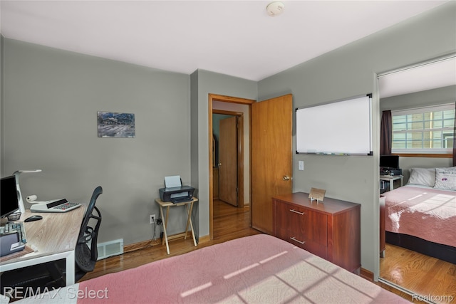 2249 Pauline Dr, Waterford, MI 48329 - bedroom with wood finished floors and an office area
