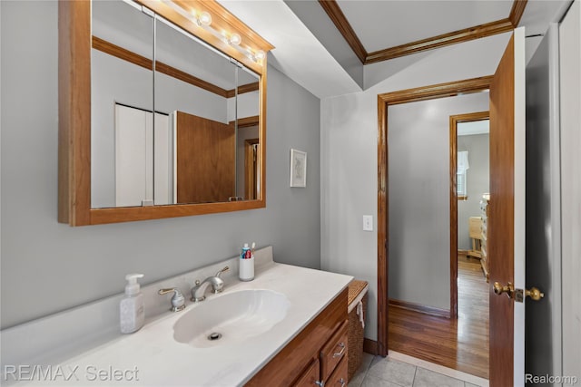 2249 Pauline Dr, Waterford, MI 48329 - bathroom with ornamental molding, vanity, and tile patterned flooring