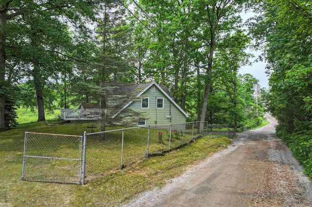 7199 Switzer Dr, Linden, MI 48451 - view of property exterior featuring a gate and driveway