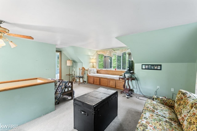 7199 Switzer Dr, Linden, MI 48451 - living area with carpet floors, ceiling fan, and vaulted ceiling