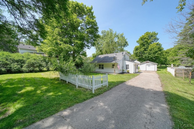 306 S Washington St, Manchester, MI 48158 - view of front of house with an outdoor structure and a detached garage