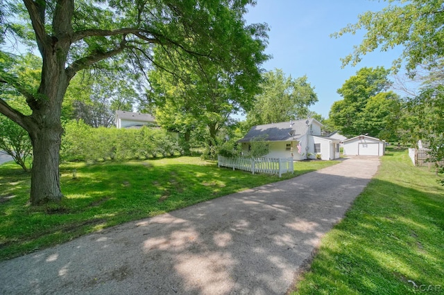 306 S Washington St, Manchester, MI 48158 - fenced yard with an outbuilding