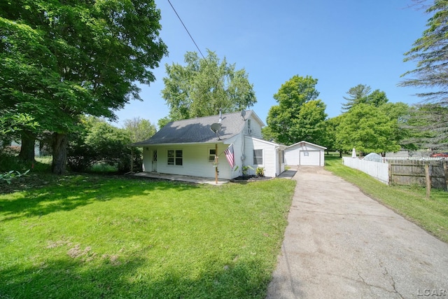 306 S Washington St, Manchester, MI 48158 - bungalow-style house featuring concrete driveway, a detached garage, and an outdoor structure