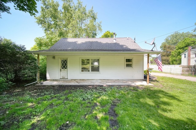 306 S Washington St, Manchester, MI 48158 - back of property featuring a patio and a shingled roof