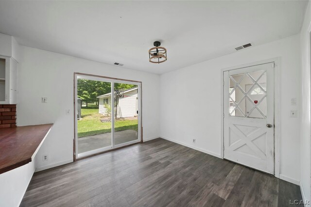 306 S Washington St, Manchester, MI 48158 - unfurnished dining area featuring wood finished floors and baseboards