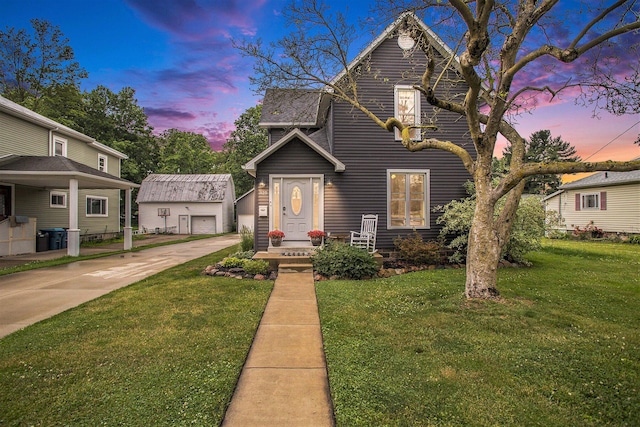 325 Marshall St, Coldwater, MI 49036 - traditional-style home with an outdoor structure, a yard, and driveway