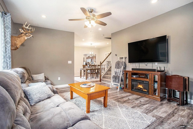 325 Marshall St, Coldwater, MI 49036 - living area with ceiling fan, wood finished floors, recessed lighting, stairway, and a chandelier