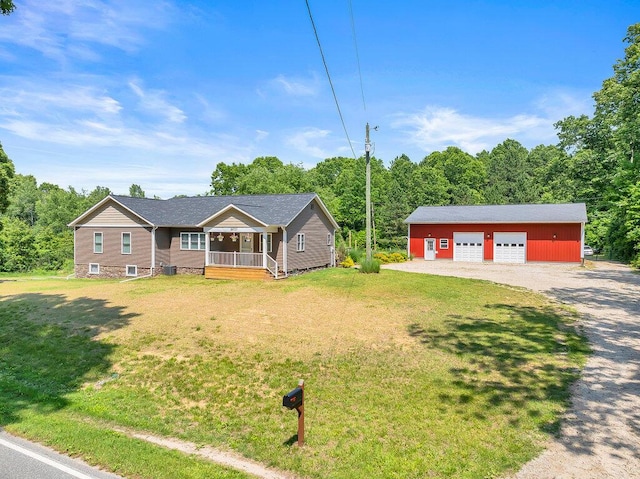 54727 Twin Lakes Rd, Dowagiac, MI 49047 - single story home featuring a garage, covered porch, an outdoor structure, and a front lawn