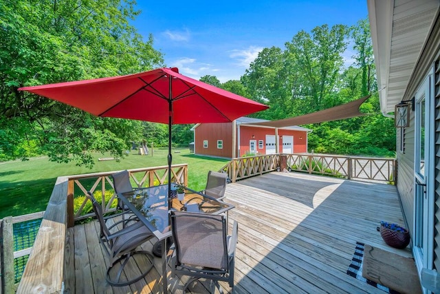 54727 Twin Lakes Rd, Dowagiac, MI 49047 - deck featuring a lawn, outdoor dining space, and view of wooded area