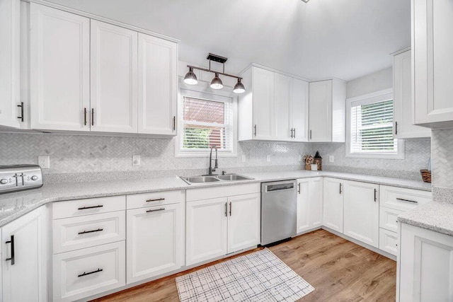 54727 Twin Lakes Rd, Dowagiac, MI 49047 - kitchen featuring stainless steel dishwasher, white cabinets, tasteful backsplash, and light wood-style floors