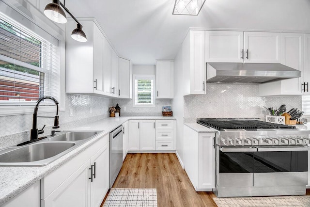 54727 Twin Lakes Rd, Dowagiac, MI 49047 - kitchen with stainless steel appliances, extractor fan, white cabinetry, and light wood finished floors