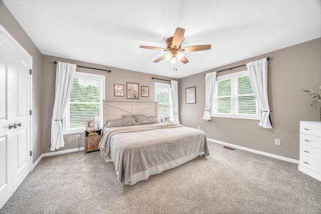 54727 Twin Lakes Rd, Dowagiac, MI 49047 - bedroom featuring multiple windows, light colored carpet, and ceiling fan