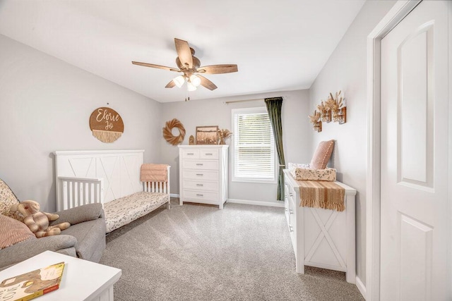 54727 Twin Lakes Rd, Dowagiac, MI 49047 - bedroom featuring light carpet, a crib, and a ceiling fan