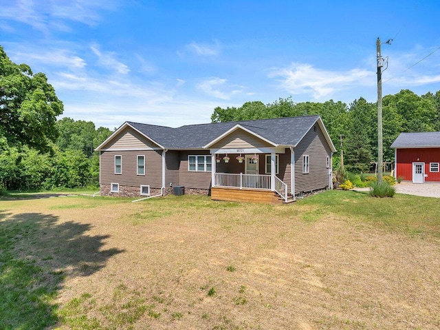 54727 Twin Lakes Rd, Dowagiac, MI 49047 - view of front of home featuring covered porch, a front lawn, and a shingled roof