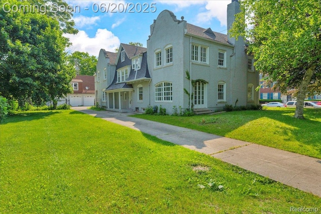 1710 Seminole St, Detroit, MI 48214 - view of front of property featuring a front yard, a chimney, and a detached garage