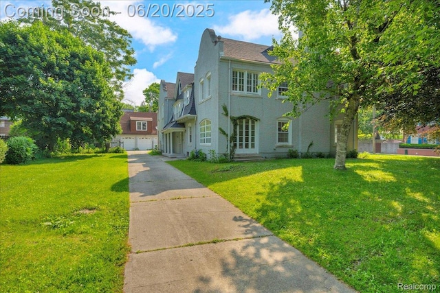 1710 Seminole St, Detroit, MI 48214 - view of front of property with a front lawn and stucco siding