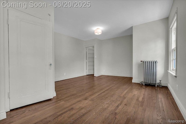 1710 Seminole St, Detroit, MI 48214 - empty room with radiator heating unit and wood finished floors