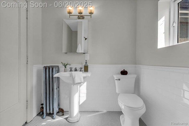 1710 Seminole St, Detroit, MI 48214 - bathroom with wainscoting, tile walls, and tile patterned floors