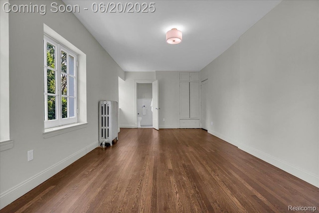 1710 Seminole St, Detroit, MI 48214 - unfurnished living room featuring radiator heating unit and wood finished floors