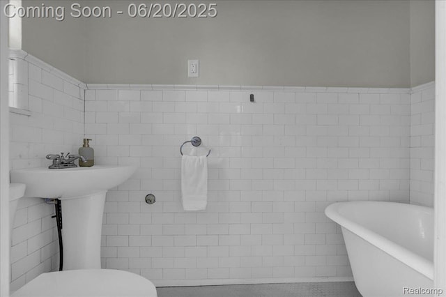 1710 Seminole St, Detroit, MI 48214 - bathroom featuring a freestanding bath and tile walls