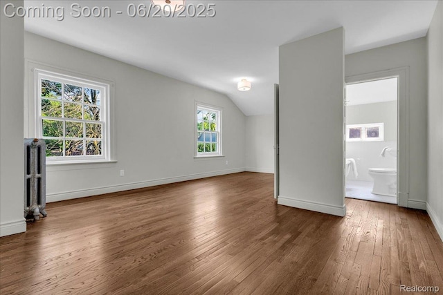 1710 Seminole St, Detroit, MI 48214 - unfurnished living room featuring wood-type flooring and vaulted ceiling