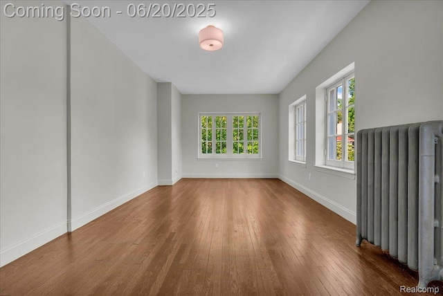 1710 Seminole St, Detroit, MI 48214 - empty room featuring radiator and hardwood / wood-style flooring