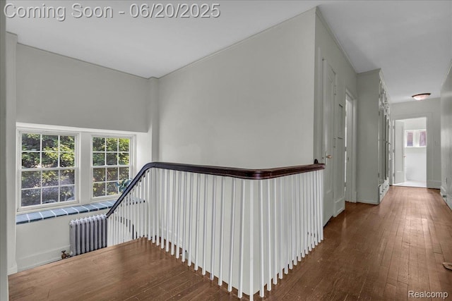 1710 Seminole St, Detroit, MI 48214 - hall featuring hardwood / wood-style flooring, radiator, and an upstairs landing