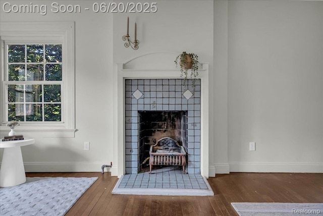 1710 Seminole St, Detroit, MI 48214 - detailed view of wood finished floors and a fireplace with raised hearth
