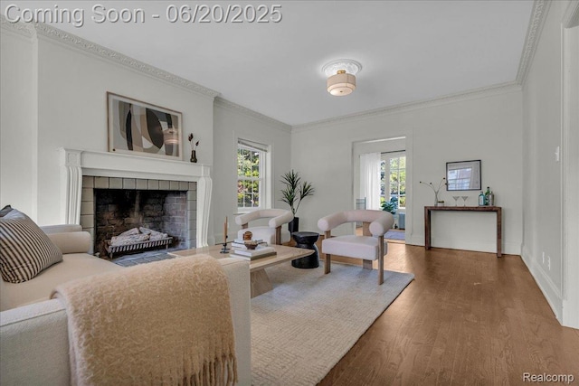 1710 Seminole St, Detroit, MI 48214 - living room featuring healthy amount of natural light, crown molding, wood finished floors, and a tile fireplace