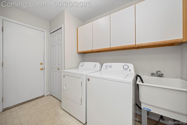 5805 Dawn Ridge Dr, Troy, MI 48098 - laundry area with cabinet space, light floors, and separate washer and dryer