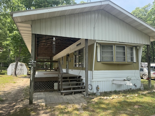 5859 N Utter Rd, Irons, MI 49644 - view of front of home with a shed and a deck