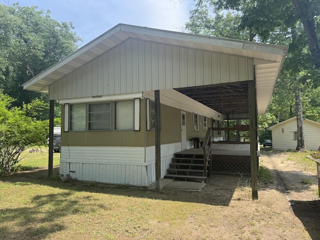 5859 N Utter Rd, Irons, MI 49644 - view of front of home with a wooden deck and a front lawn