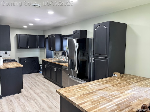 1745 Wisconsin Ave, Marysville, MI 48040 - kitchen with refrigerator with ice dispenser, butcher block countertops, backsplash, light wood-style floors, and dishwasher
