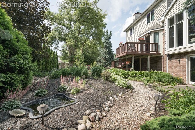 4096 Villager Dr, Lake Orion, MI 48359 - view of yard featuring a deck