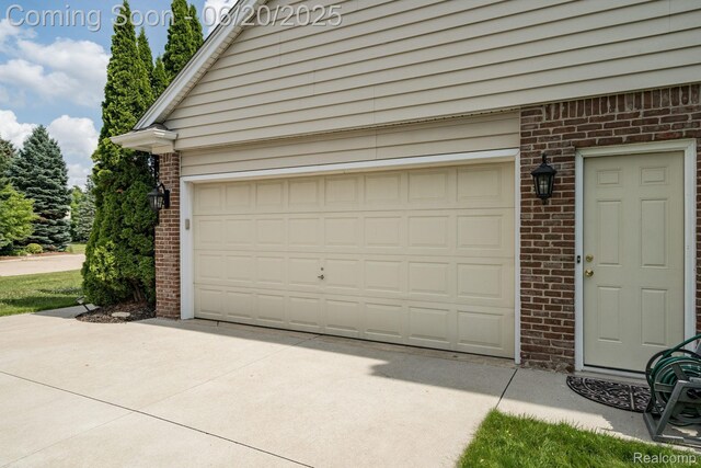 4096 Villager Dr, Lake Orion, MI 48359 - garage with driveway