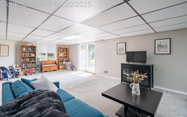 4096 Villager Dr, Lake Orion, MI 48359 - carpeted living room with a drop ceiling and baseboards