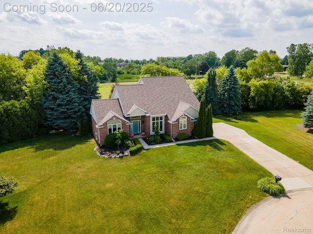 4096 Villager Dr, Lake Orion, MI 48359 - view of front facade featuring a front yard, concrete driveway, and brick siding