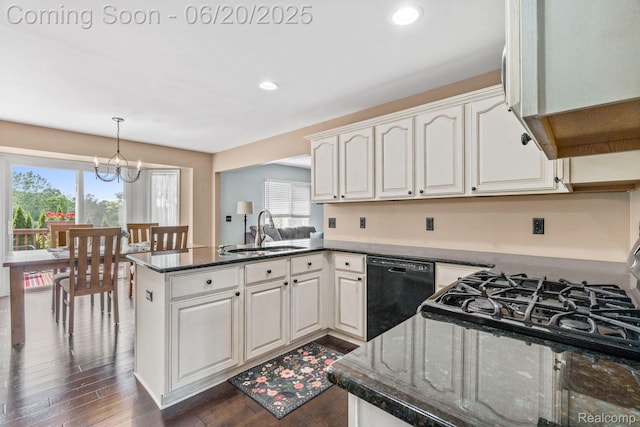 4096 Villager Dr, Lake Orion, MI 48359 - kitchen with black dishwasher, a peninsula, a chandelier, dark wood-style floors, and white cabinets