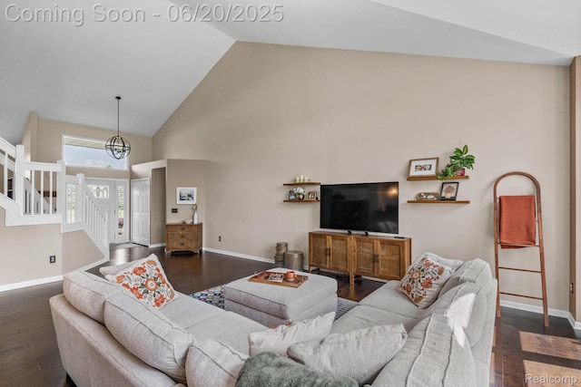 4096 Villager Dr, Lake Orion, MI 48359 - living room featuring high vaulted ceiling, dark wood-style floors, stairway, and a chandelier
