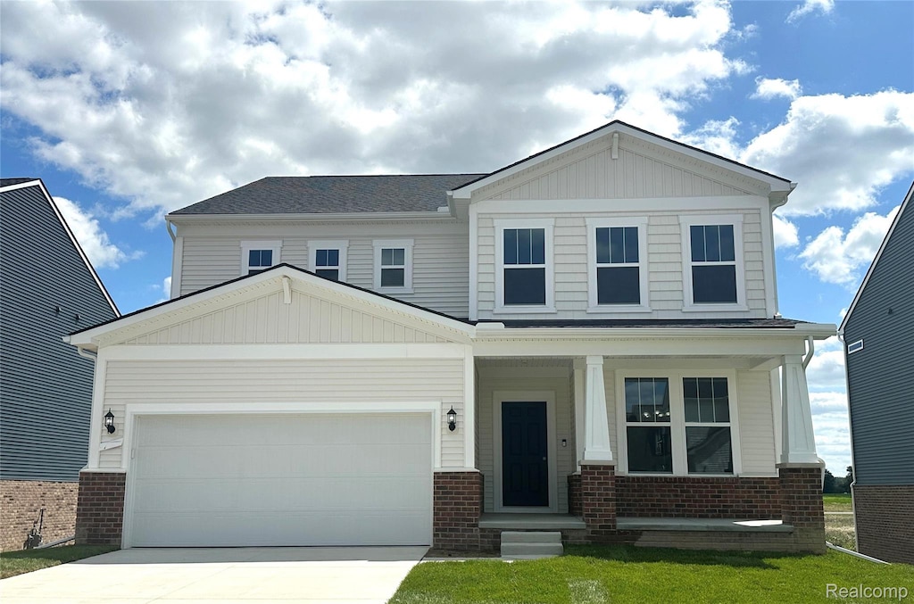879 Risdon Trl S, Saline, MI 48176 - craftsman-style house featuring brick siding, driveway, a porch, and an attached garage