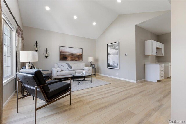 2553 Marlborough St, Detroit, MI 48215 - living room featuring lofted ceiling, light wood-style floors, and recessed lighting