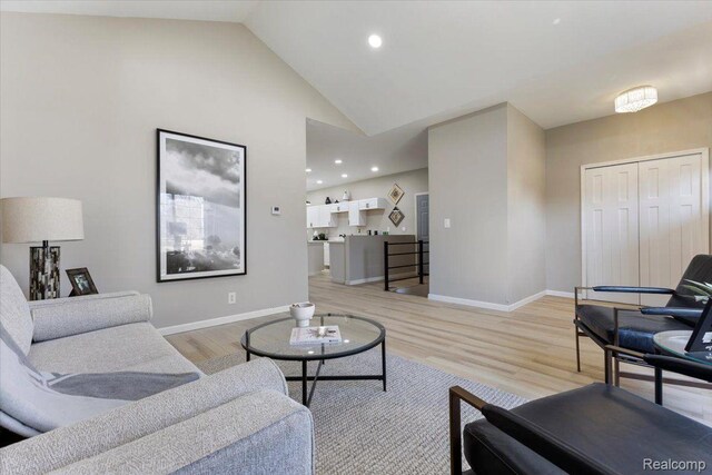 2553 Marlborough St, Detroit, MI 48215 - living area with light wood-type flooring, recessed lighting, and high vaulted ceiling