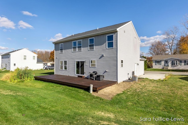 6561 Van Dam Ave, Hudsonville, MI 49426 - back of property with a wooden deck and a yard