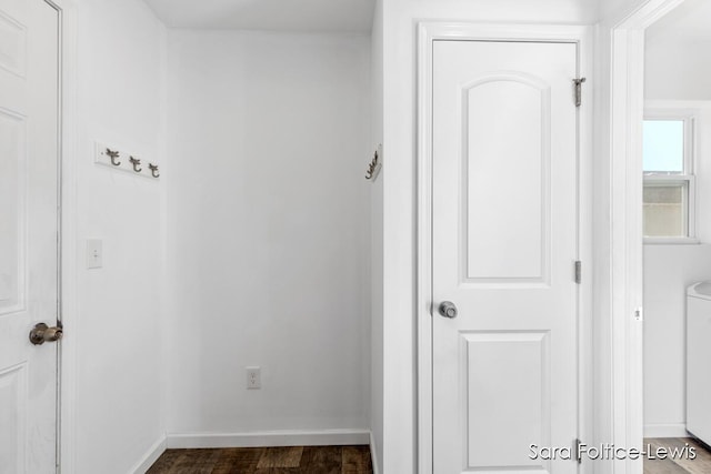 6561 Van Dam Ave, Hudsonville, MI 49426 - corridor featuring dark wood-type flooring and washer / clothes dryer