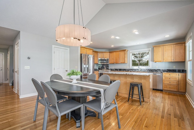 2069 Watermark Dr SE, Grand Rapids, MI 49546 - dining room featuring light wood finished floors, recessed lighting, and vaulted ceiling