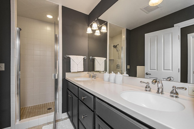 2069 Watermark Dr SE, Grand Rapids, MI 49546 - bathroom featuring a stall shower, double vanity, a chandelier, and recessed lighting