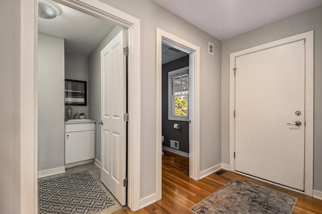2069 Watermark Dr SE, Grand Rapids, MI 49546 - entryway featuring light wood-style floors and baseboards