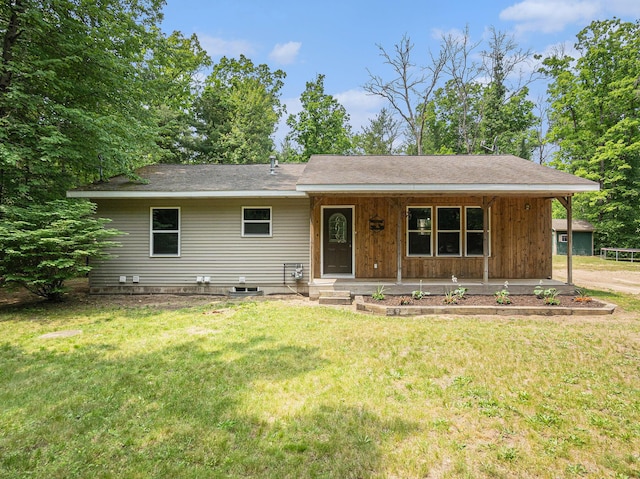 8577 Loveless Dr, Howard City, MI 49329 - single story home with a porch, a front lawn, and a shingled roof