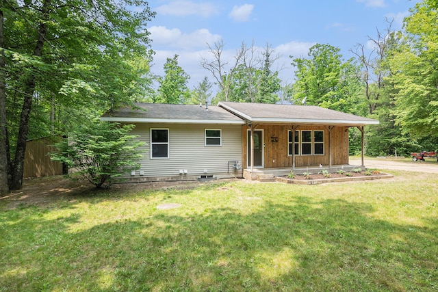 8577 Loveless Dr, Howard City, MI 49329 - single story home with covered porch and a front lawn
