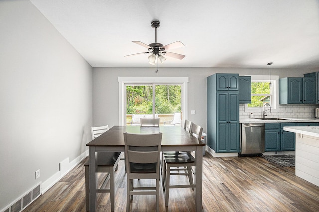 8577 Loveless Dr, Howard City, MI 49329 - dining space featuring dark wood finished floors and ceiling fan